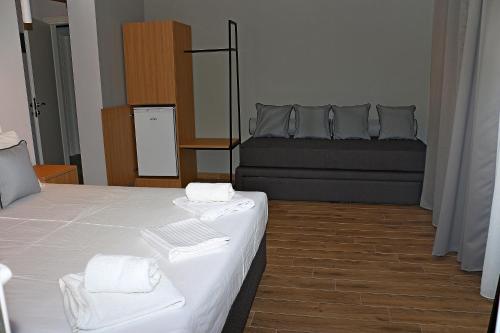 Ένα ή περισσότερα κρεβάτια σε δωμάτιο στο Oneiro Zois