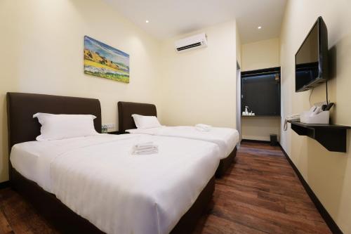 Katil atau katil-katil dalam bilik di Hotel Le-Shore