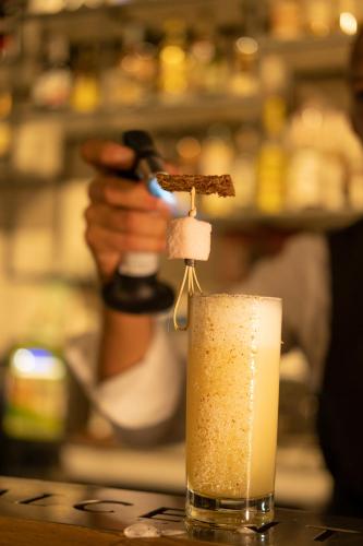a drink is being poured into a glass at Albergo Centrale in Lamezia Terme