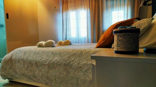 a bedroom with a bed with two towels on it at Casa João Rodas in Soajo