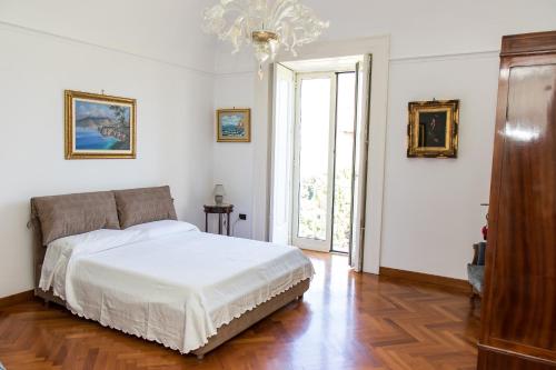 Postel nebo postele na pokoji v ubytování Capitano Nino Guest House