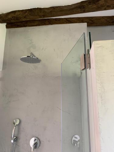 a shower with a glass door in a bathroom at Quinta Ribeira do Labrador - Lisbon West Wine Route in Alenquer