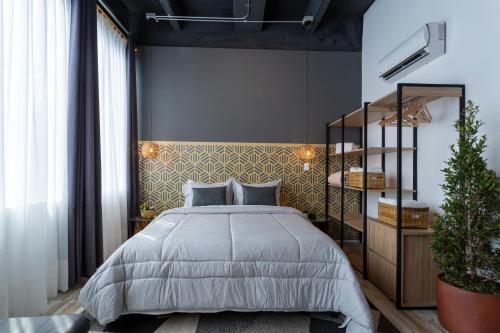 Säng eller sängar i ett rum på Hotel Lexum Estadio