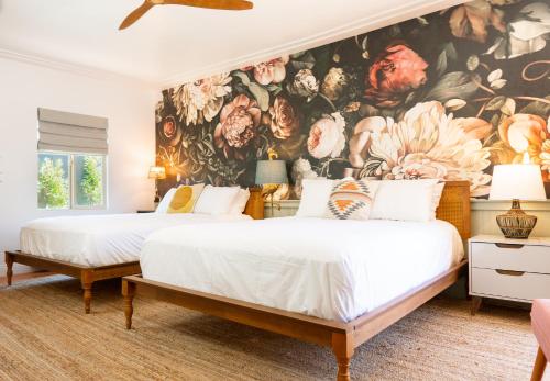 Postel nebo postele na pokoji v ubytování Fleur Noire Hotel