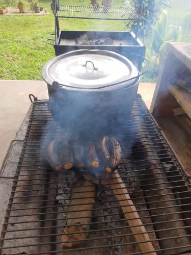 a grill with a pot on top of it at FINCA CORENAS in La Cumbre
