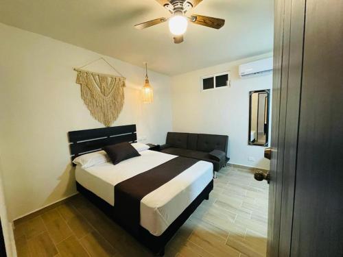 En eller flere senge i et værelse på Corazon de Tulum