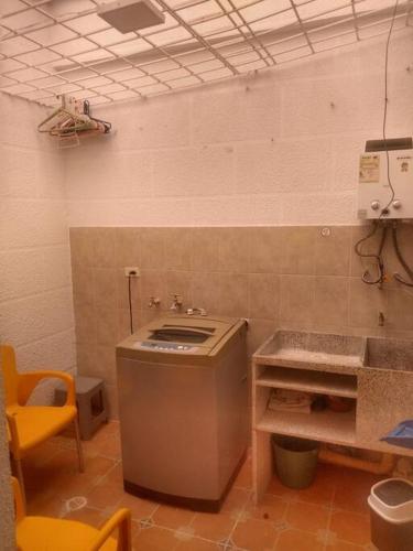 a kitchen with a counter and a sink in a room at Apartamento Vacacional centro San Gil in San Gil