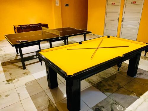 two ping pong tables sitting on top of a floor at Pousada Beira Mar in Pitimbu