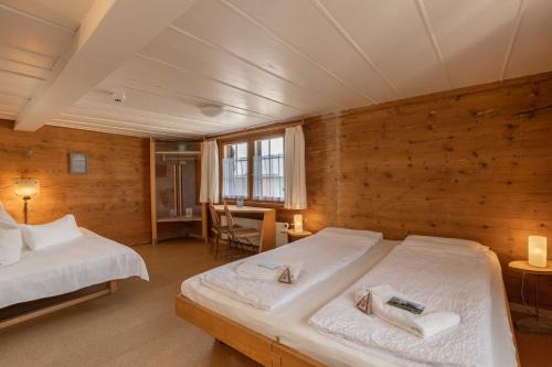 Postel nebo postele na pokoji v ubytování Gasthaus Rössli