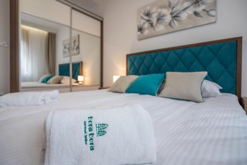 Postel nebo postele na pokoji v ubytování Bora Bora Apartmani Zlatibor