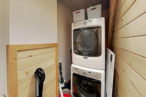 a small microwave sitting on top of a refrigerator at Lazy Lumberjack Grande in Franklin