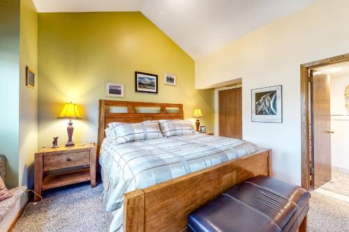 a bedroom with a large bed and a chair at Stonebridge Valley View in Park City