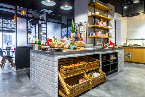 a kitchen with a counter with baskets of food at Park Inn by Radisson Poznan in Poznań