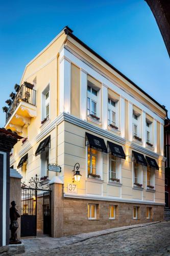 a building on a street in front at Gallery 37 Powered by ASTON in Plovdiv