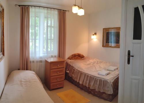 Łóżko lub łóżka w pokoju w obiekcie Zajazd Turystyczny Stara Gawęda