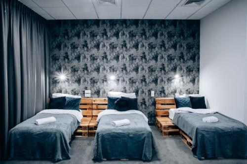 Ένα ή περισσότερα κρεβάτια σε δωμάτιο στο Apartamenty EXPO Nadarzyn 3Rooms