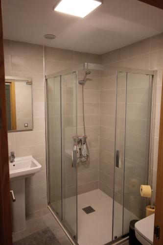a bathroom with a shower and a sink at SUN, SEA AND ROCKS in Puerto de Mogán