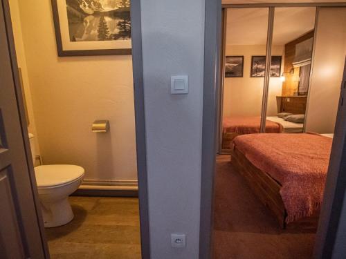 a bathroom with a bed and a toilet in a room at Appartement Valmorel, 3 pièces, 4 personnes - FR-1-356-324 in Valmorel