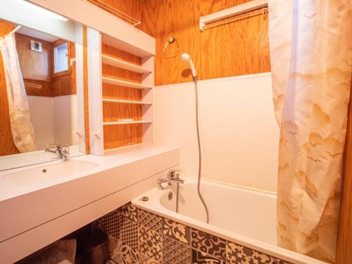 a bathroom with a shower and a sink and a tub at Appartement Valmorel, 2 pièces, 6 personnes - FR-1-356-329 in Valmorel