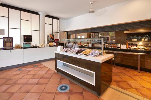 a kitchen with a counter with some food on it at Sol Pelicanos Ocas in Benidorm