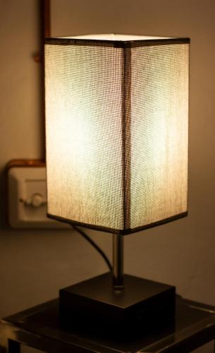 a lamp sitting on top of a table at Maison di Lidia - Smart Holiday in Mantova
