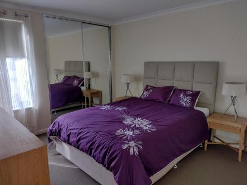 Giường trong phòng chung tại Cape View Villa- 74