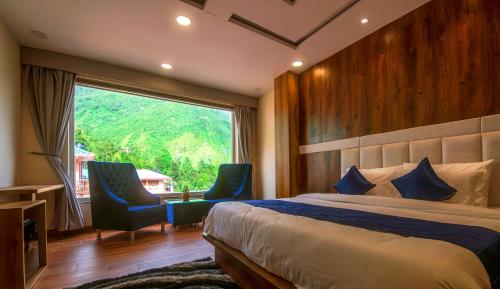 Ένα ή περισσότερα κρεβάτια σε δωμάτιο στο Tripli Hotels Shivaay