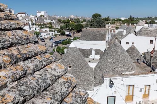 an aerial view of a town with roofs at Quercus in Alberobello