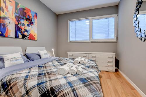 a bedroom with a bed with towels on it at Villette Dolci Luxury Homes in Peschiera del Garda