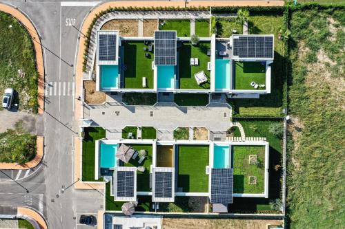 an overhead view of a house with solar panels on it at Villette Dolci Luxury Homes in Peschiera del Garda