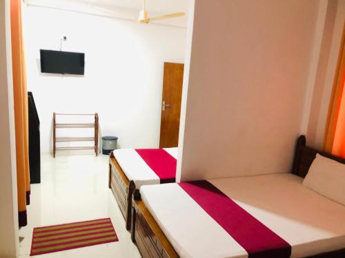 Postel nebo postele na pokoji v ubytování Hotel Lovusiyah