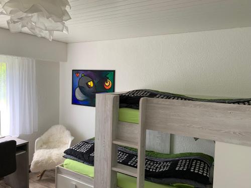 a bedroom with two bunk beds in a room at Haus Linaria - CharmingStay in Flumserberg