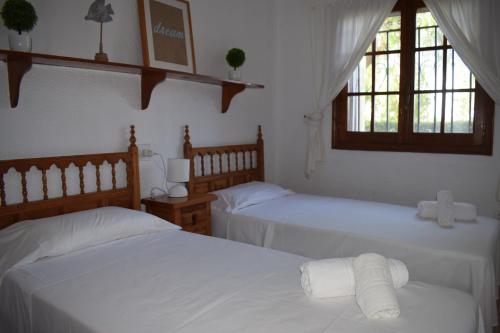 A bed or beds in a room at Anacasa Marineta Bot PB2103