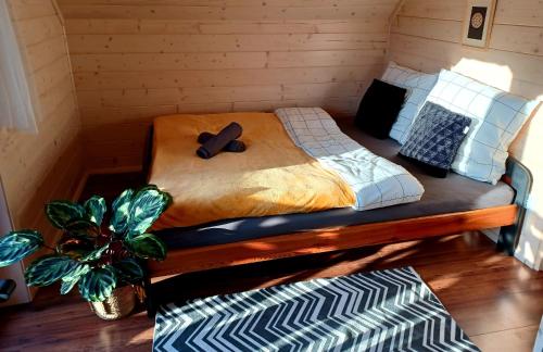 a large bed in a room with at Gazdówka - najlepsza miejscówka domek w Pieninach in Krościenko