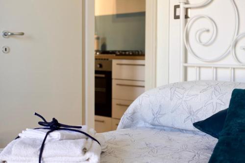 Postel nebo postele na pokoji v ubytování Uno Scorcio di Blu
