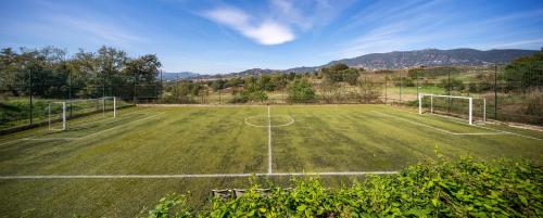 a soccer field with two soccer goals on it at El Rebastral - Mas Vinyoles Natura in Sant Pere de Torelló