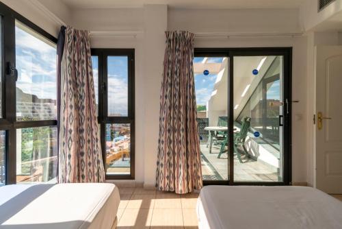 Ένα ή περισσότερα κρεβάτια σε δωμάτιο στο Sunshine Beach Villas