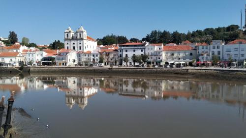 a view of a city with a river and buildings at Hotel Ordem De Santiago in Alcácer do Sal