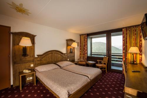 Postel nebo postele na pokoji v ubytování Hotel Central Résidence