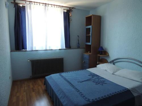 Postel nebo postele na pokoji v ubytování Apartment Nela