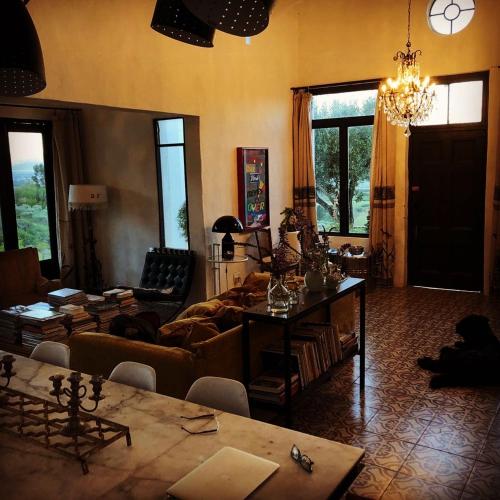 a living room with a couch and a table at Kleinkloof Farm in Piketberg