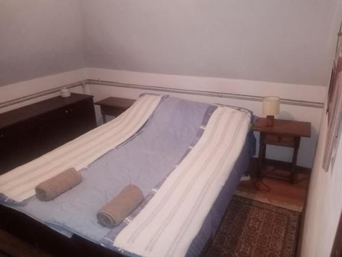 a bed in a small room with at Farma koza Olga in Ivanovo