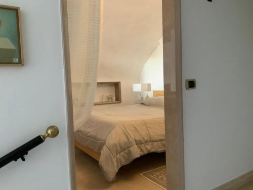 Giường trong phòng chung tại Suite a mare - Casa della Poetessa