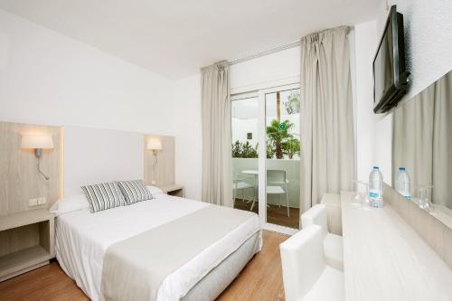 Кровать или кровати в номере Sentido Fido Tucan - Beach Hotel