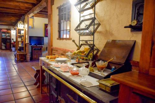 a kitchen with a counter with food on it at Posada Real El Rincón de Babia in La Cueta