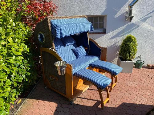 a pair of chairs sitting on a patio at Ferienhaus Wattwurm in Rysum