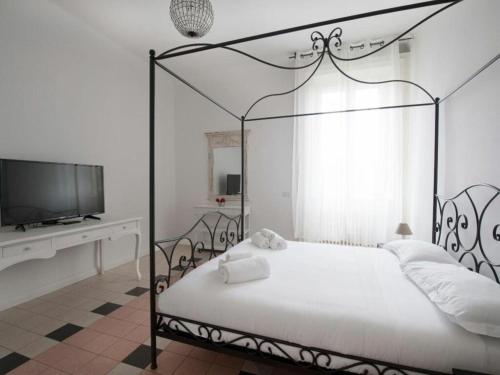 A bed or beds in a room at Bacone Liberty Vittoria by Halldis