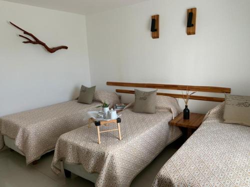 Ліжко або ліжка в номері BARAKA - Posada