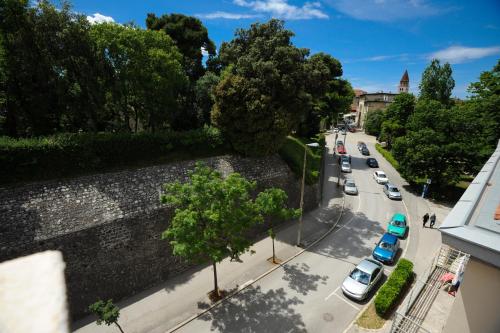 a view of a city street with cars parked at Feel Good Penthouse With Jacuzzi in Zadar