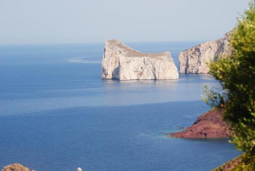 a group of large rocks in the water at B&B Del Viale in Bacu Abis